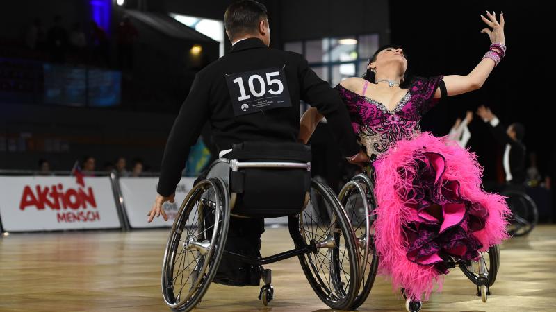 A couple in wheelchairs dancing