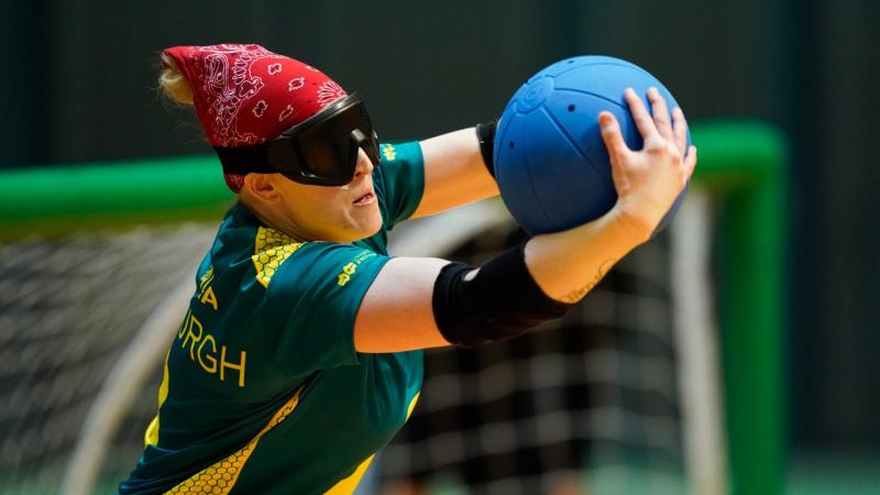 Female goalball player prepares to release the ball