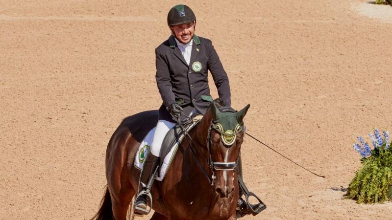 Saudia Arabian man riding a horse