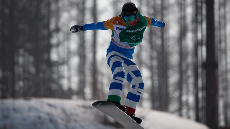 A man snowboarding