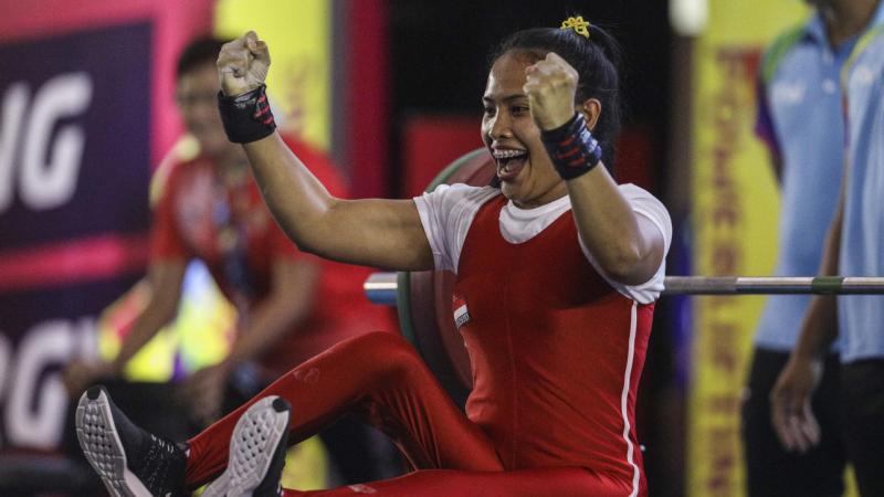 Indonesia Para powerlifter celebrates after her lift