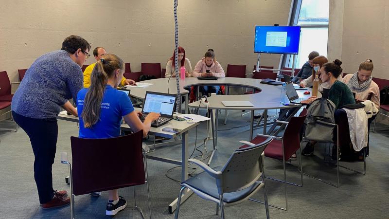 Group of students working in a round table