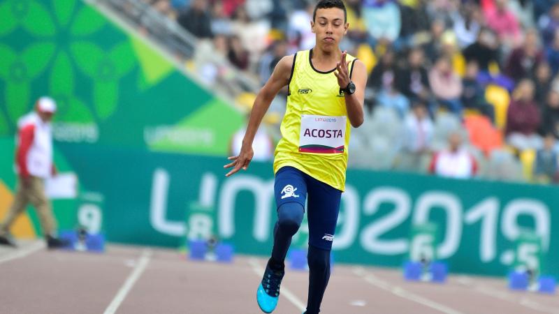 Colombian male athlete sprinting on the track