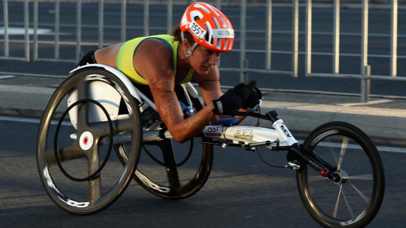 Female wheelchair racer competing 