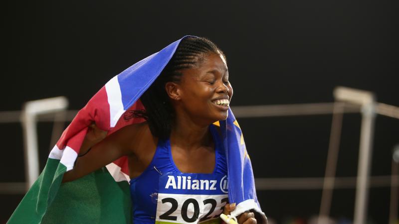 Johanna Benson holding the Namibian flag