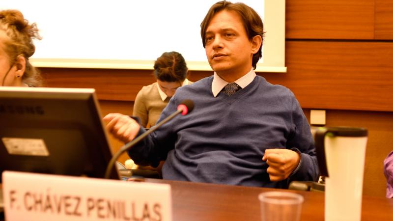 Man speaking at round table