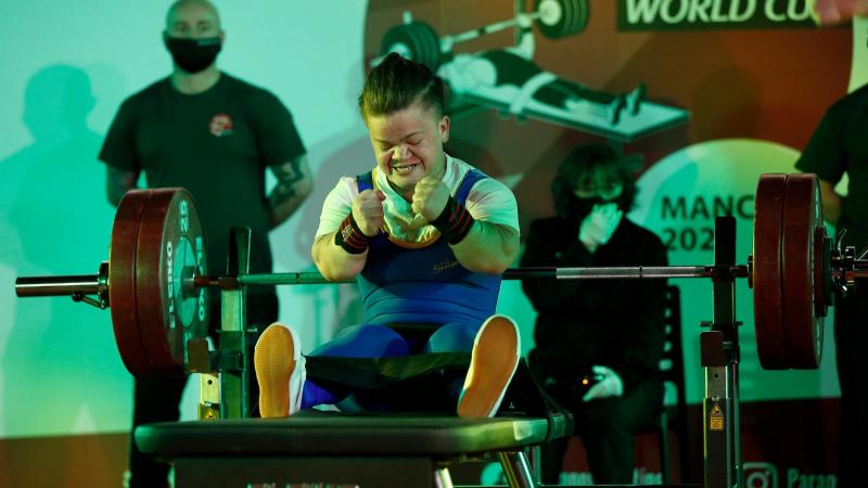 Mariana Shevchuk celebrates after successfully lifting the bar