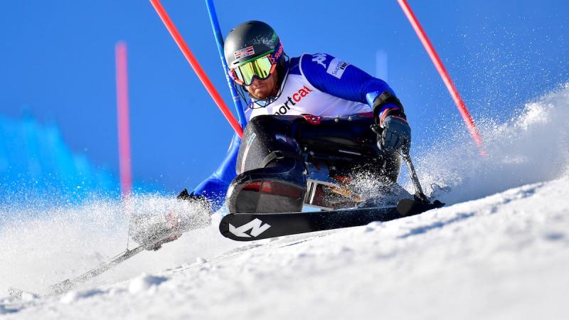 A male sit-skier in a slalom competition