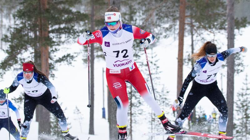 Vilde Nilsen competing in cross country skiing alongside other two women athletes 