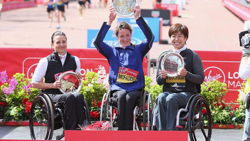 Three women in wheelchairs on the podium after the 2016 London Marathon
