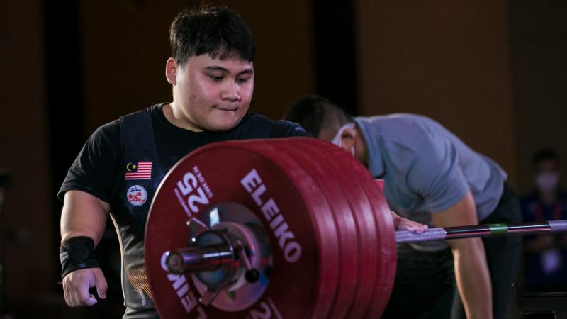 Bonnie Bunyau Gustin stares at the bar