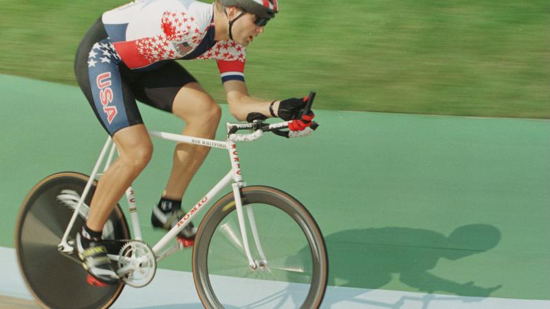 US cyclist with one arm competing on the track during the Atlanta 1996 Paralympics