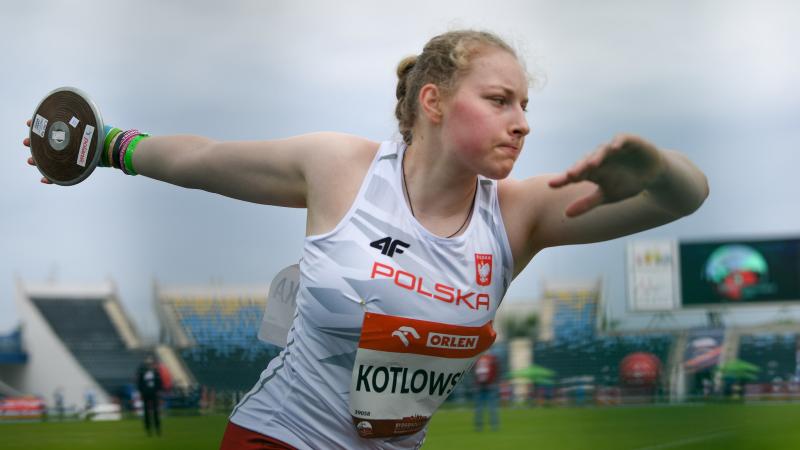 A woman competing in the discus throw in an athletics event