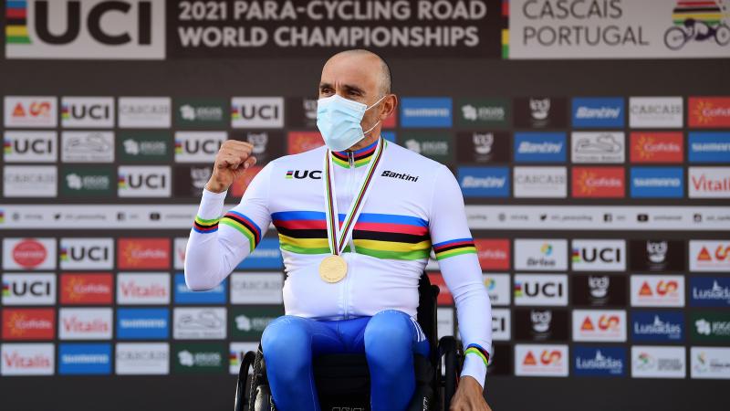 Italian Para cyclist Luca Mazzone in his wheelchair on the podium