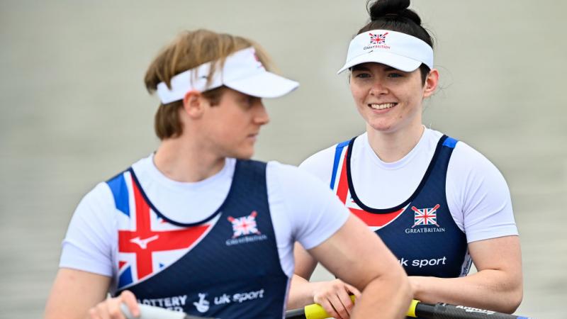 Double sculls crew with man and woman on boat