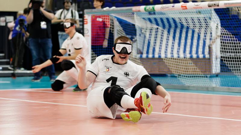 Male goalball player celebrates on the court