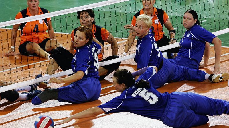 Woman dives trying to save volleyball 