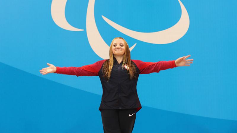 USA's McKenzie Coan celebrates on the podium at the medal ceremony for the women's 100m Freestyle - S7 at Rio 2016 Paralympic Games.