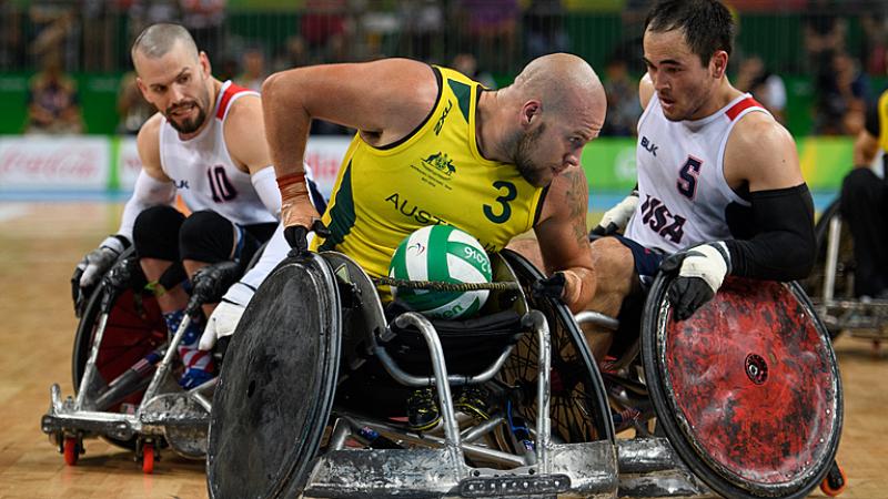 Ryley Batt tries to steer away from USA wheelchair rugby players