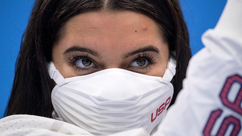 Close up of Anastasia Pagonis of USA brown eyes, brown hair and white USA mask