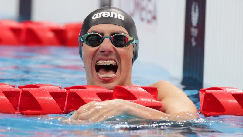 Chilean Alberto Abarza celebrates winning the celebrates winning the men's 100m backstroke S2