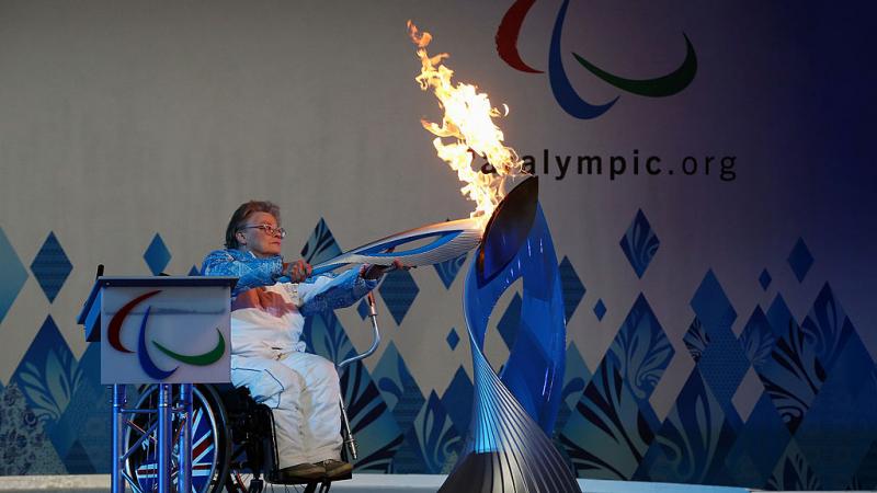 File photo of  Paralympian Caz Walton lighting the torch during the Paralympic Heritage Flame lighting ceremony at Stoke Mandeville Stadium in  England.