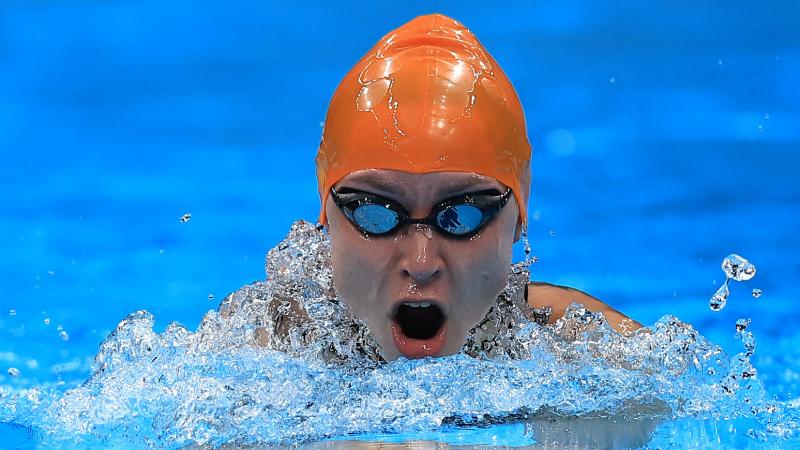 A woman swimming breaststroke