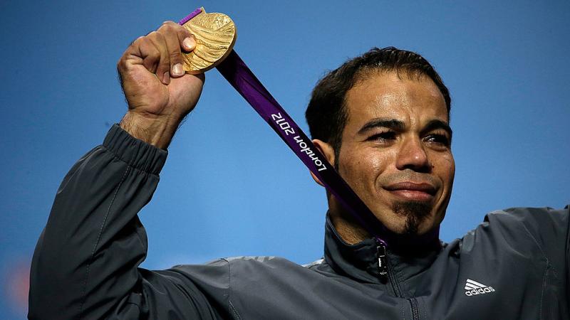Sherif Osman holds up his London 2012 gold medal