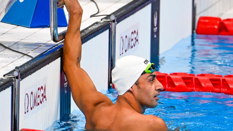 Refugee Paralympic athlete Ibrahim Al Hussein in the pool after a race
