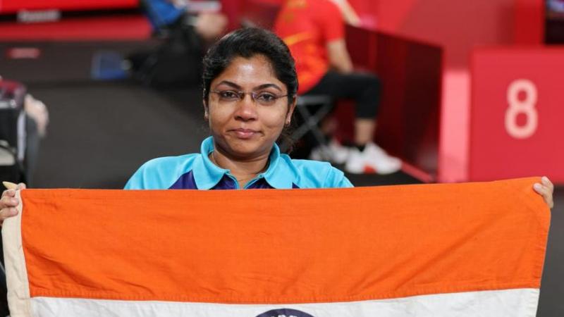 Bhavinaben Patel poses with the Indian flag after her historical performance