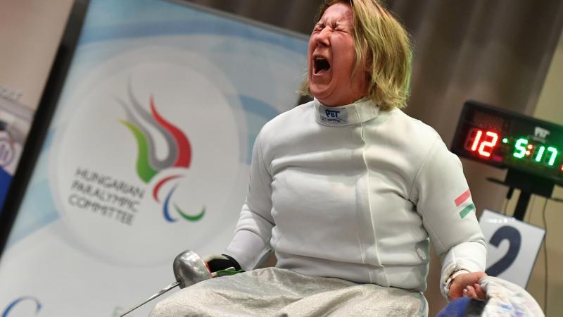 Hungarian wheelchair fencer Zsuzsanna Krajnyak celebrates