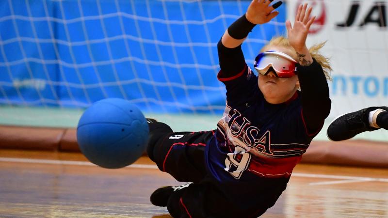 US goalball player Marybai Huking throws herself to the floor to prevent a ball from flying into the net