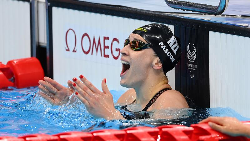 Sophie Pascoe celebrates in the pool after winning her 10th Paralympic title in Tokyo