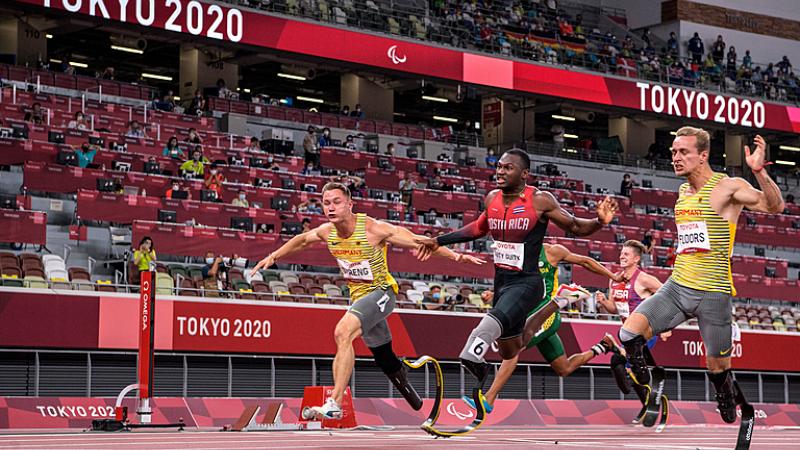 Amazing finish in the 100m with three male sprinters crossing the line about the same time