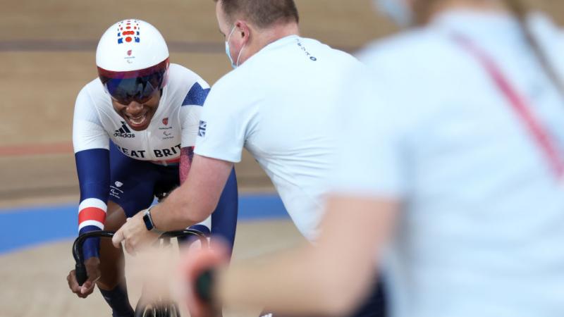 Woman on track cycle pushes to win