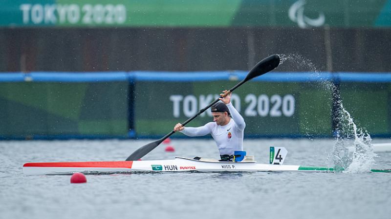 Peter Pal Kiss splashes water up in a strong stroke in his kayak