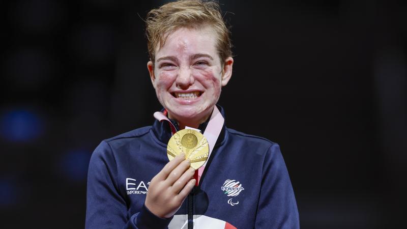Italian wheelchair fencer Bebe Vio poses with her Tokyo Paralympic gold medal