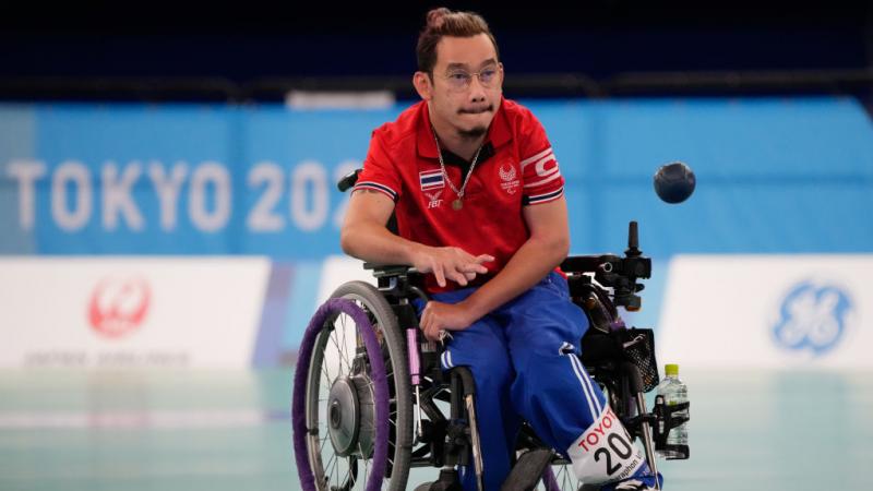 Watcharaphon Vongsa bites his lip in concentration as he throw the boccia ball