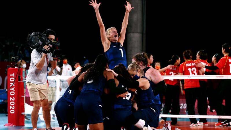 Team United States celebrate victory after winning the Women's Sitting Volleyball gold match against China at the Tokyo 2020 Paralympic Games.