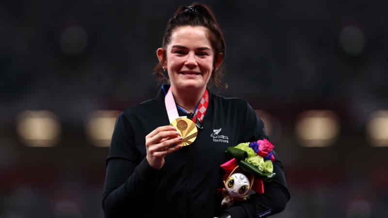 THE SMILE SAYS IT ALL: Holly Robinson of Team New Zealand poses with her gold medal after she competes in the women's javelin - F46 at the Tokyo 2020 Paralympic Games.