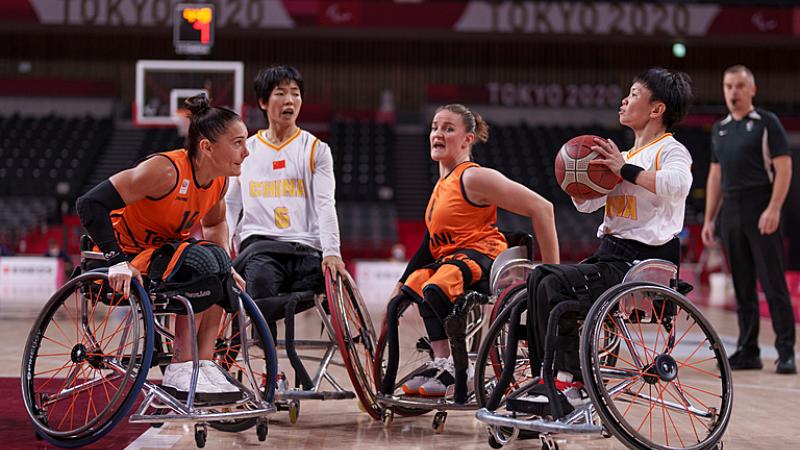 Chinese female basketball player prepares to shoot