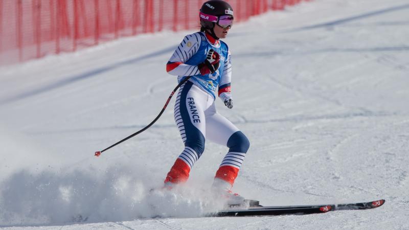 A female skier on a ski slope 