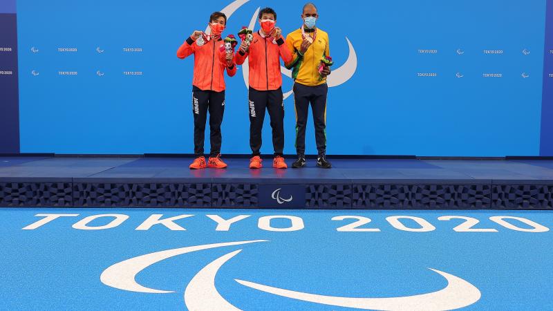 Keiichi Kimura stands on the top of the podium at Tokyo 2020 following his gold medal performance