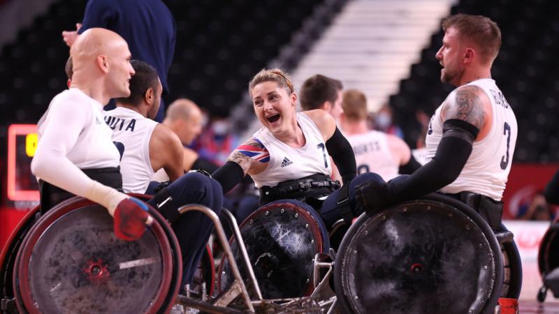 Kylie Grimes of Great Britain celebrates with teammates after defeating United States to win the Wheelchair Rugby gold at the Tokyo 2020 Paralympic Games.