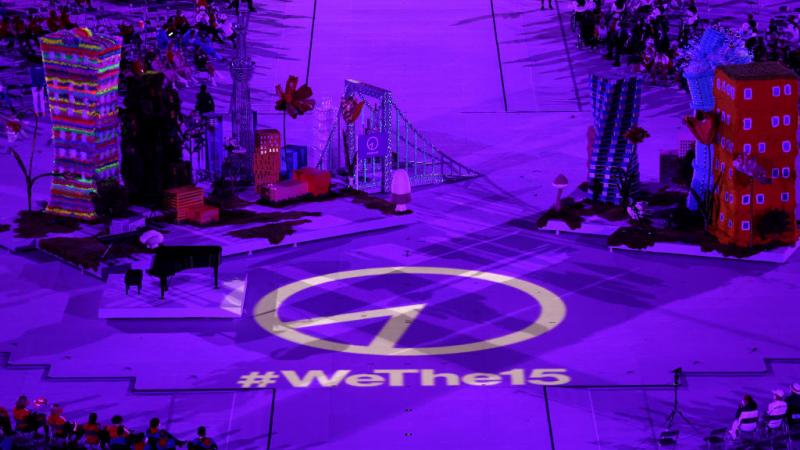 Wethe15 emblem lights up on the stage floor.