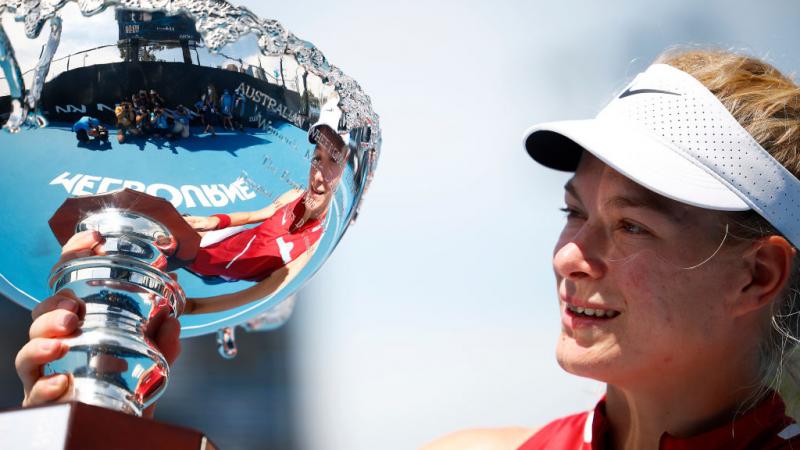 AT HER BEST: Diede De Groot of Netherlands poses with the trophy after winning her women's Wheelchair Singles final. 