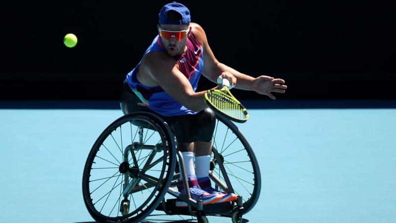 Dylan Alcott of Australia plays a forehand in his men's Quad Wheelchair singles semifinals against Andy Lapthorne of Great Britain at the 2022 Australian Open.