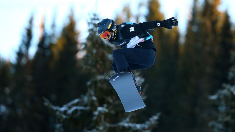 A male Para snowboarder during a competition 