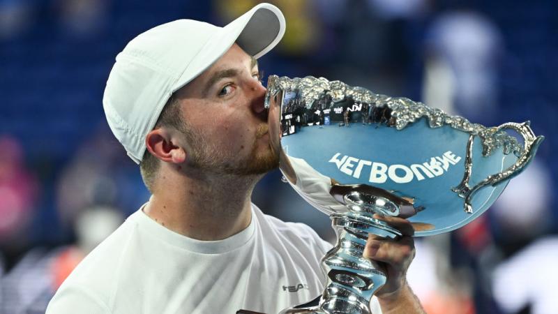 TASTE OF SUCCESS: Sam Schroder of Netherlands kisses the trophy after winning the Australian Open Quad Wheelchair Singles final against Dylan Alcott of Australia at Melbourne Park. 