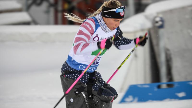 A female sit-skier in a Para cross-country skiing competition